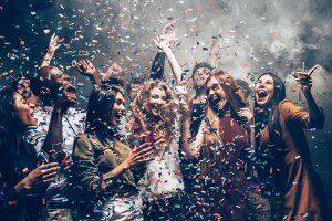 fun_motion_group_beautiful_young_people_throwing_colorful_confetti_while_dancing_looking_happy fun_motion_group_beautiful_young_people_throwing_colorful_confetti_while_dancing_looking_happy